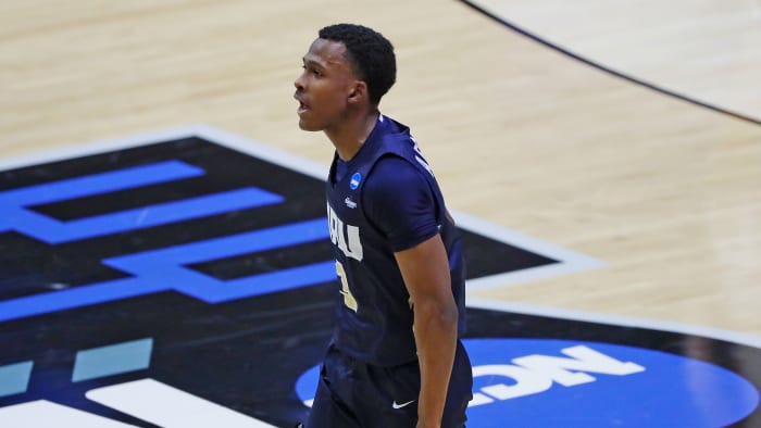 Oral Roberts’s Max Abmas celebrates after a making a basket.